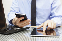 man at desk using technology