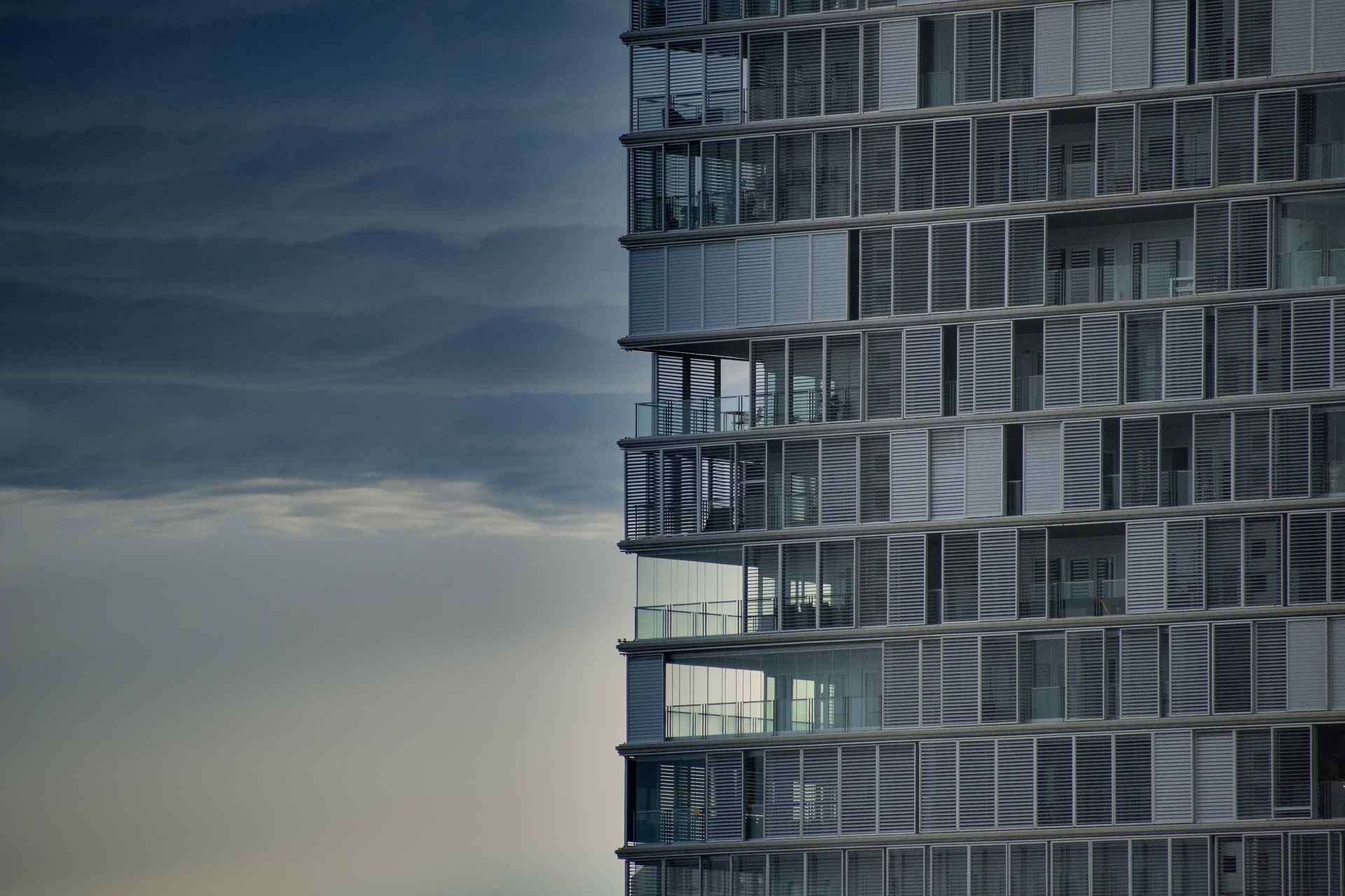 apartment complex with sunset in background