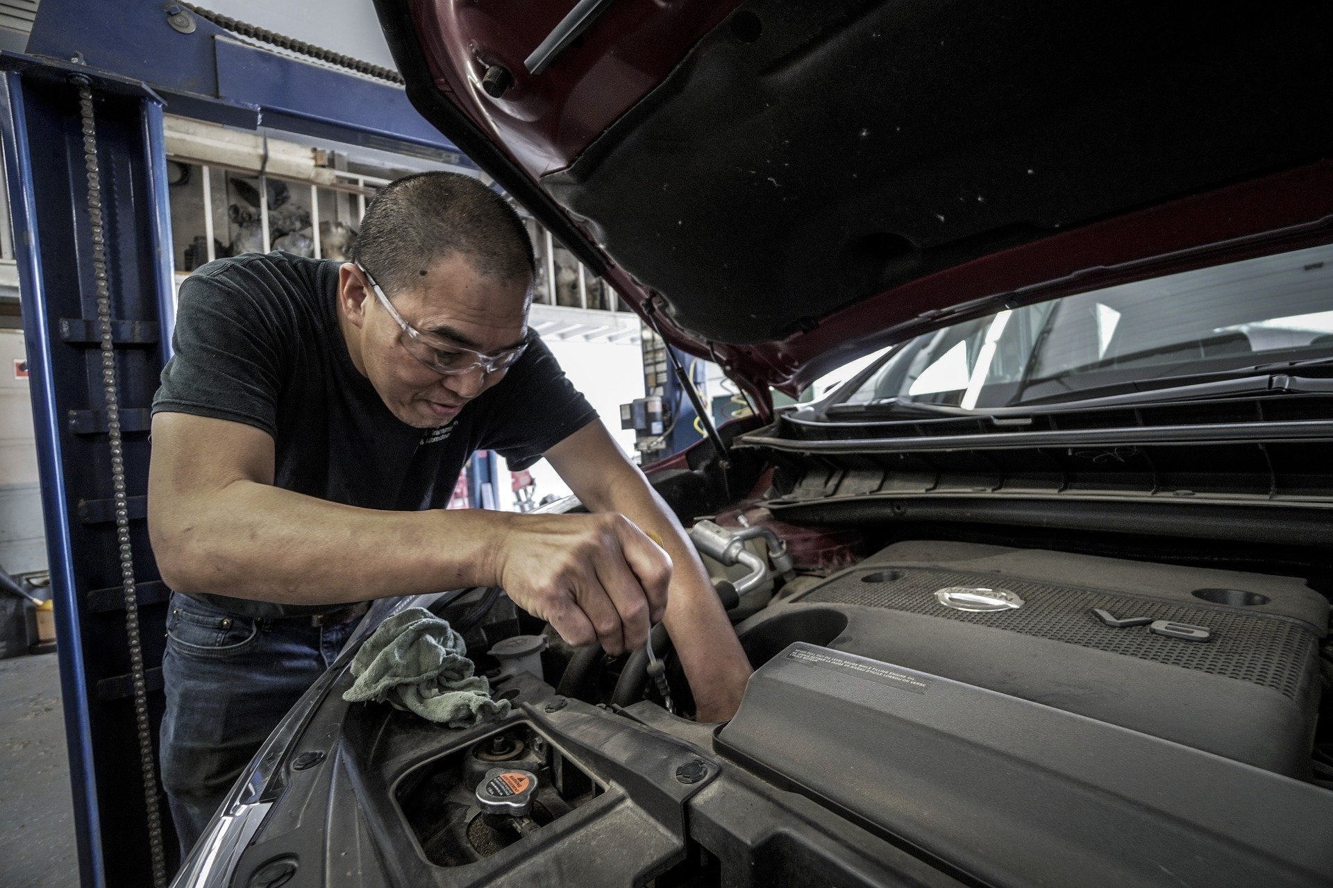 Older man working on engine