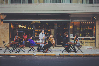 people eating lunch on an outdoor patio