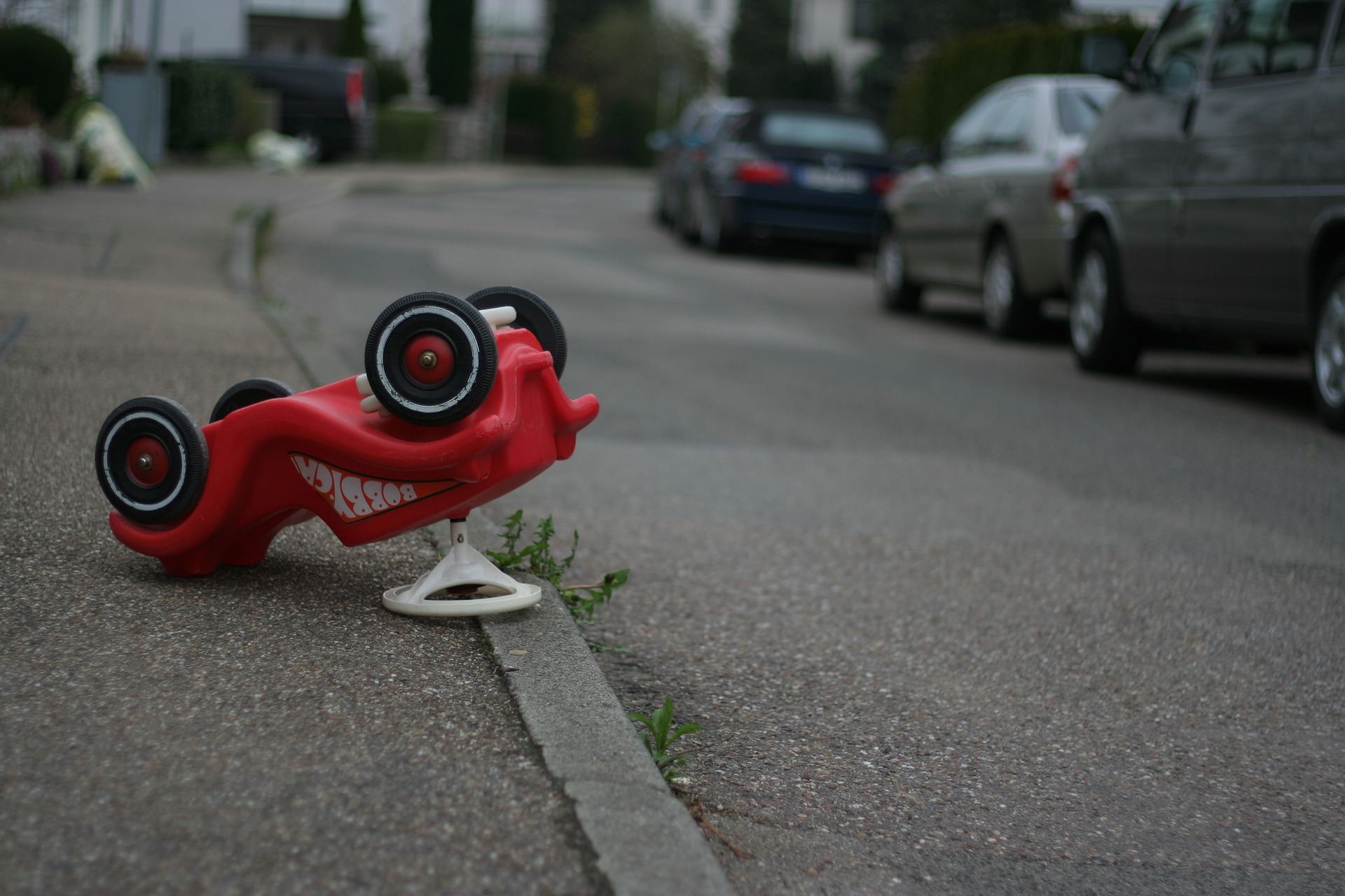 toy car upside down in road