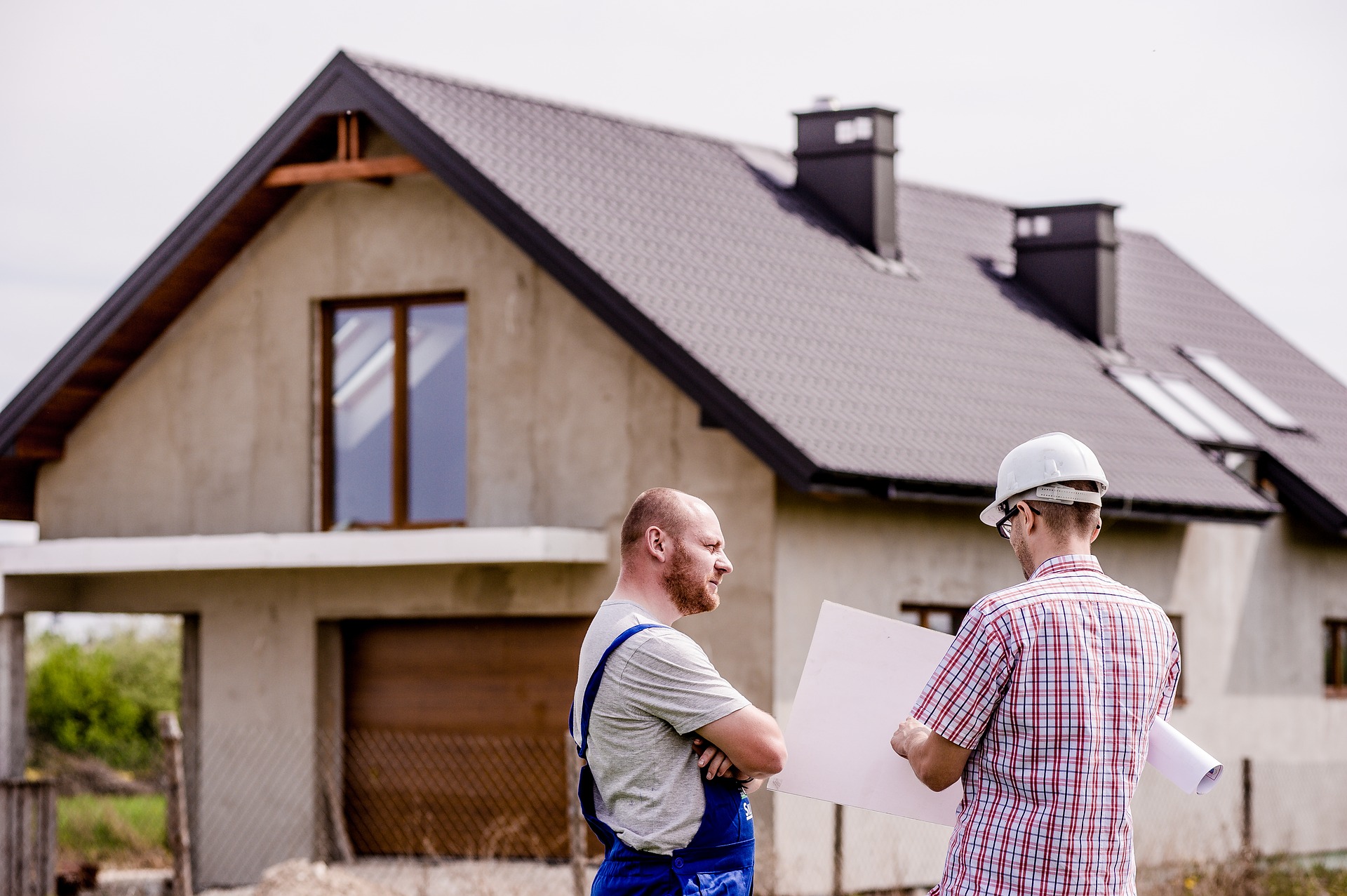 workers outside a house