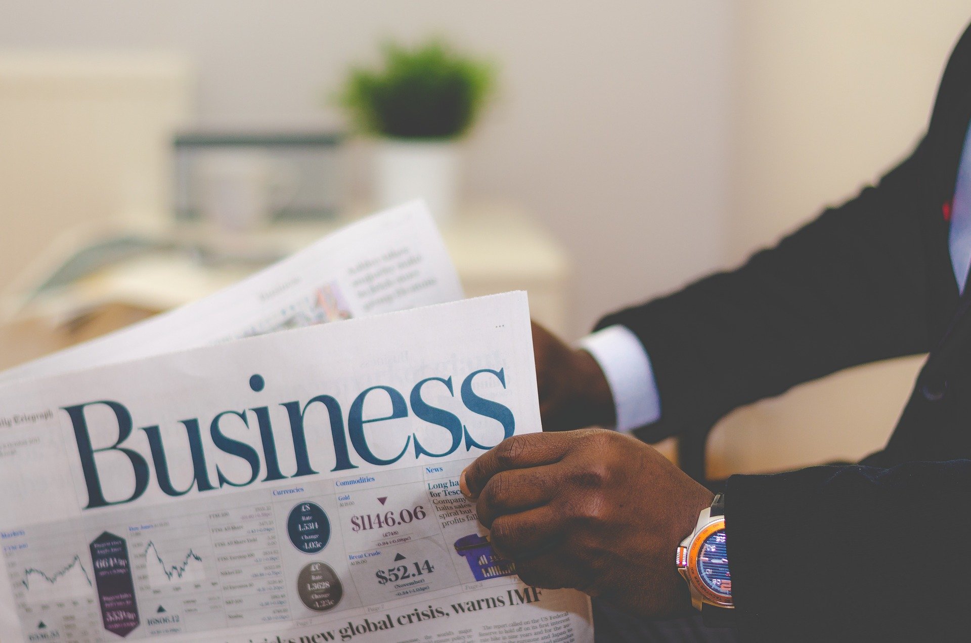 man reading business pages