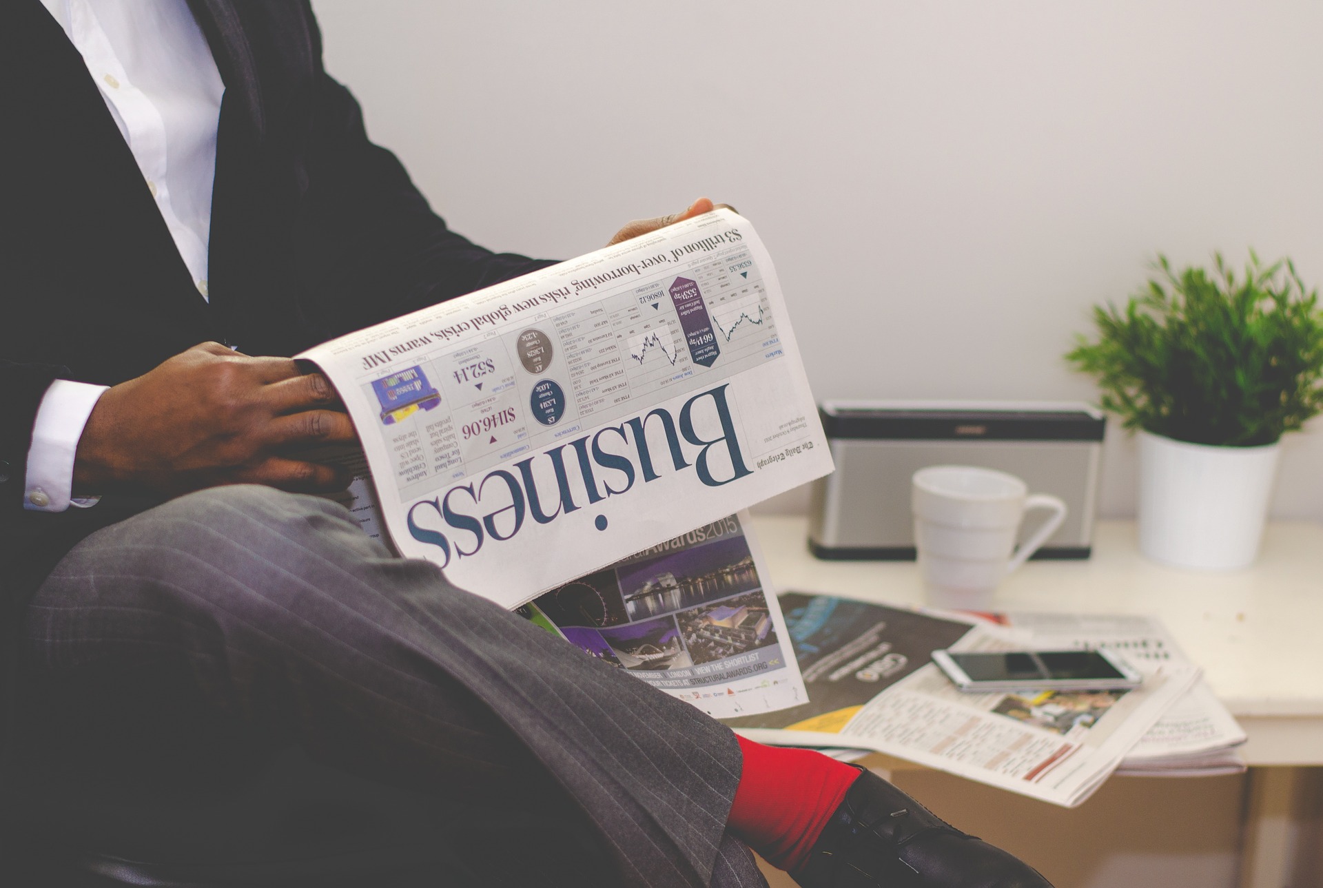 businessman reading newspaper