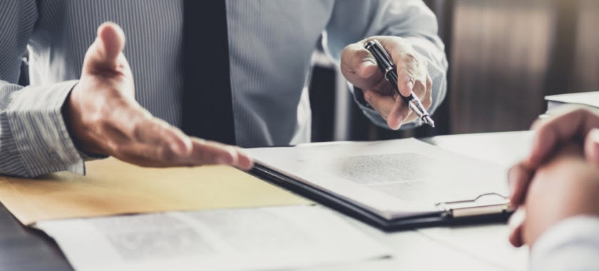 two people reviewing legal documents