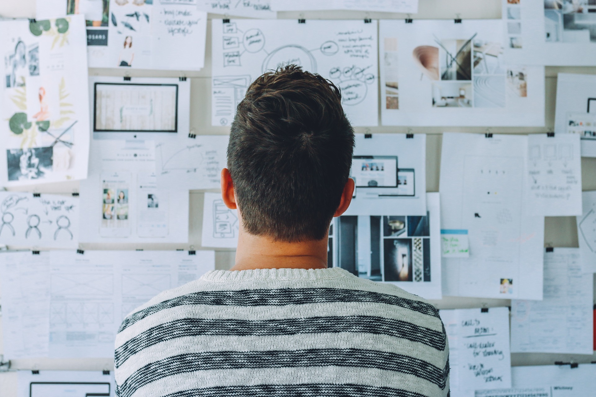 man standing in front of whiteboard