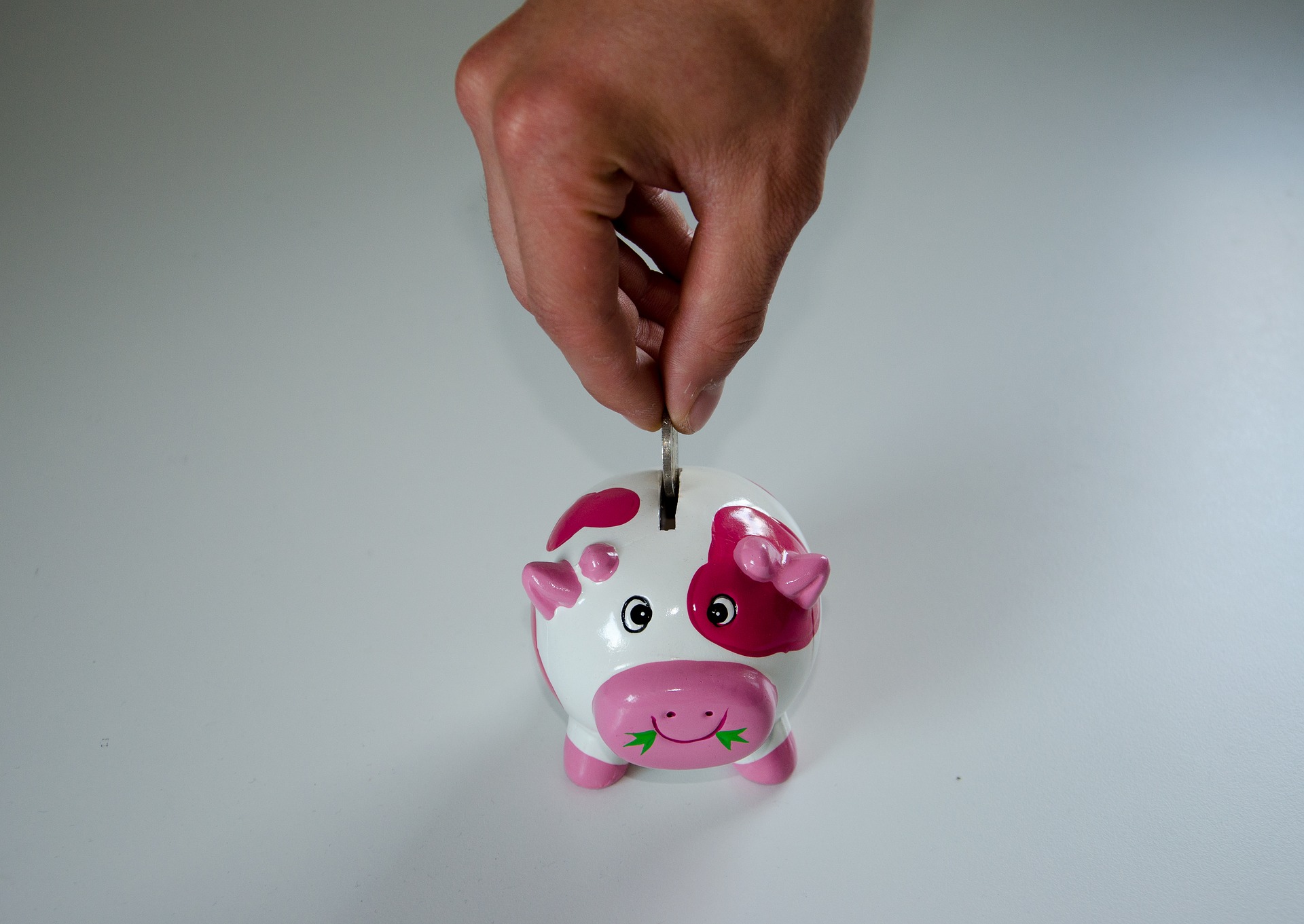 coin going into piggy bank