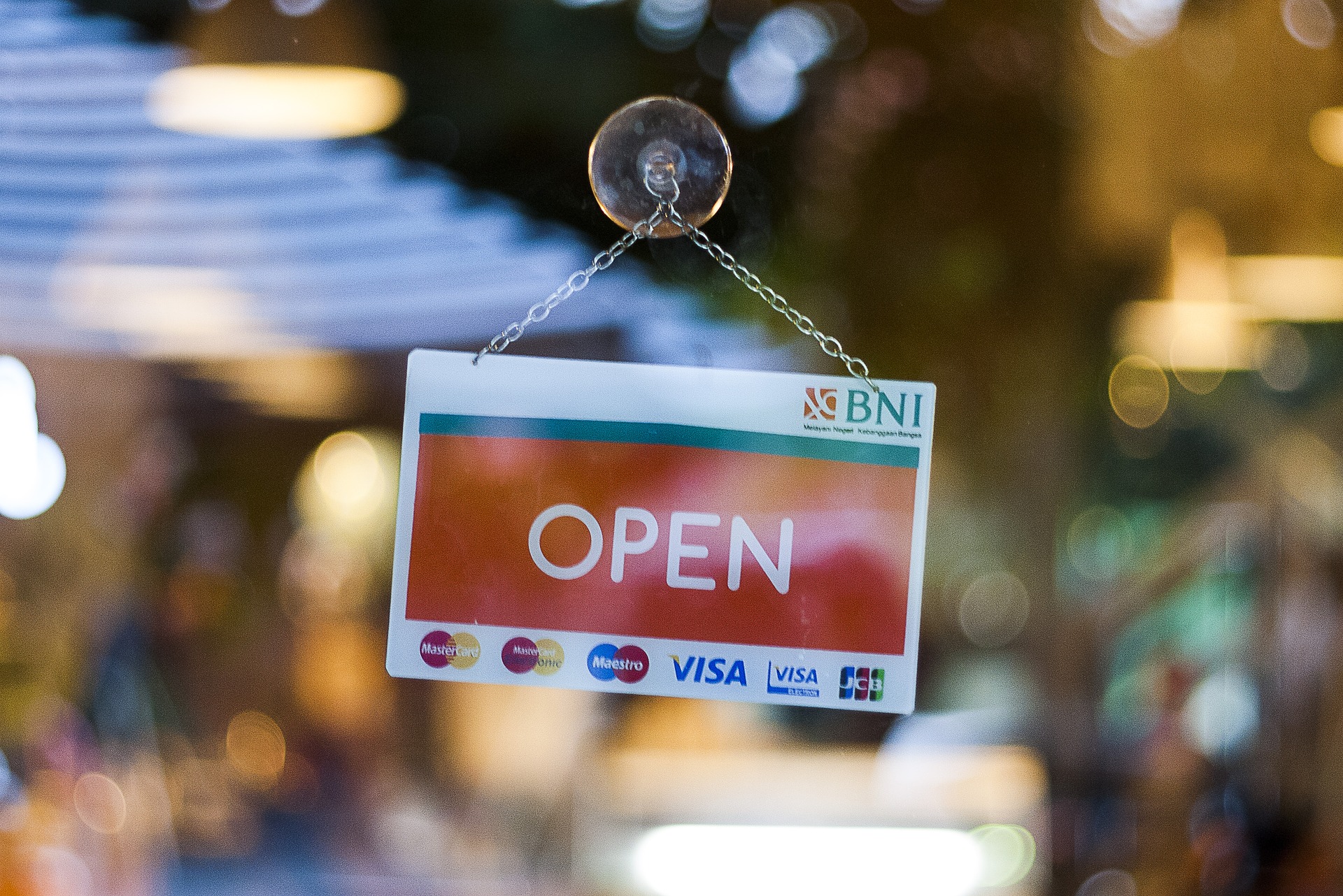 open sign on a business window