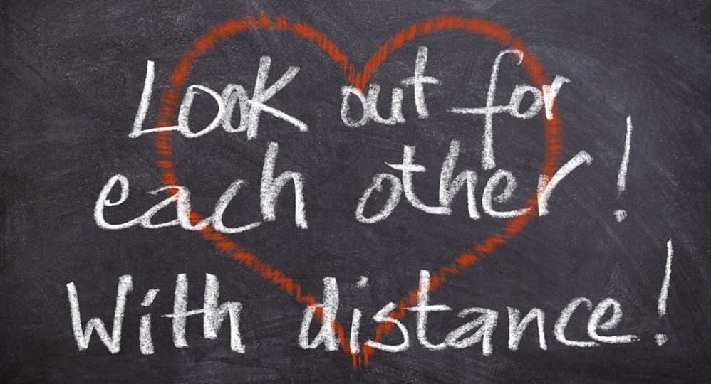 Heart image with text that says look out for each other with distance