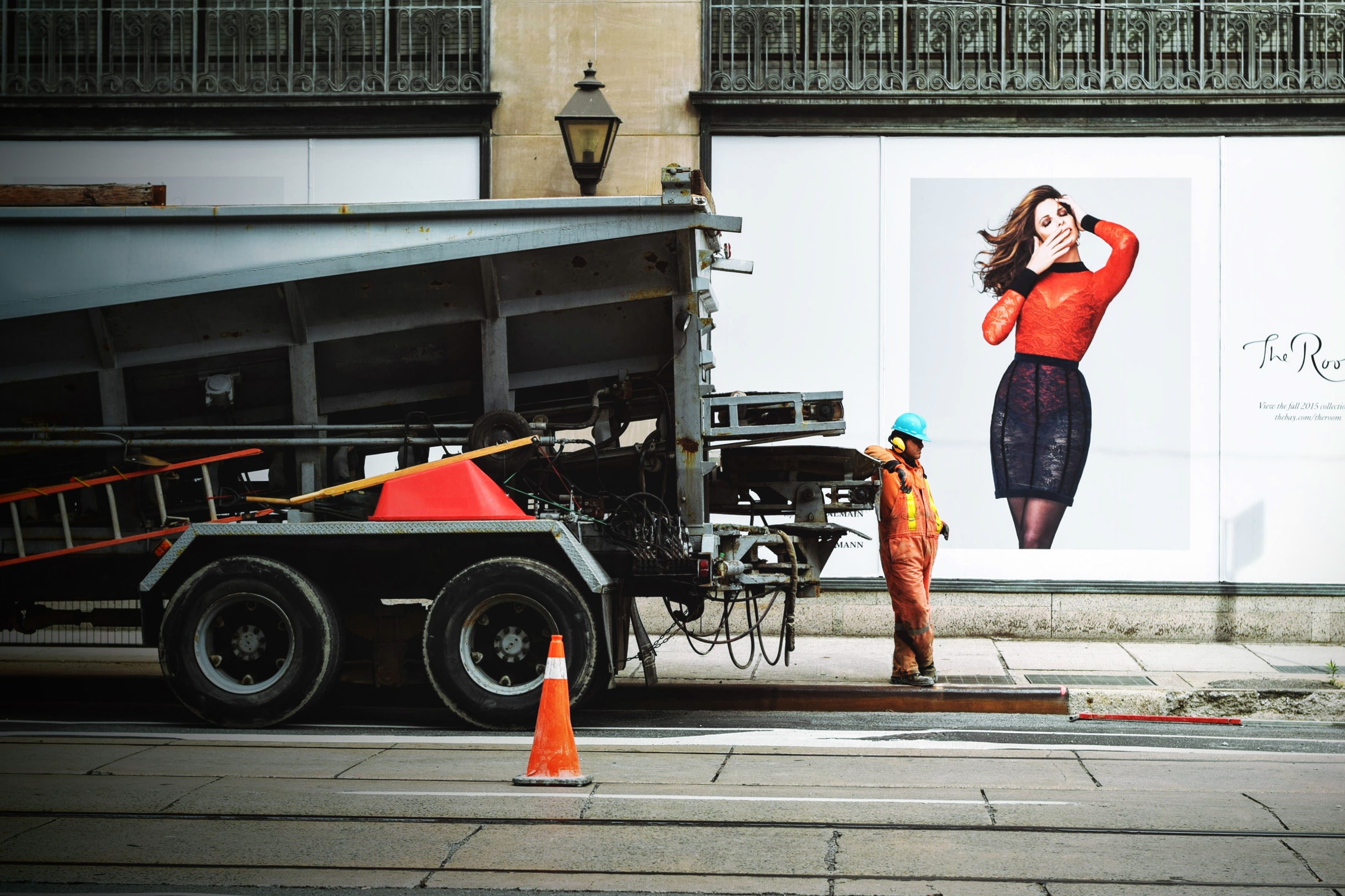 construction worker leaning on truck