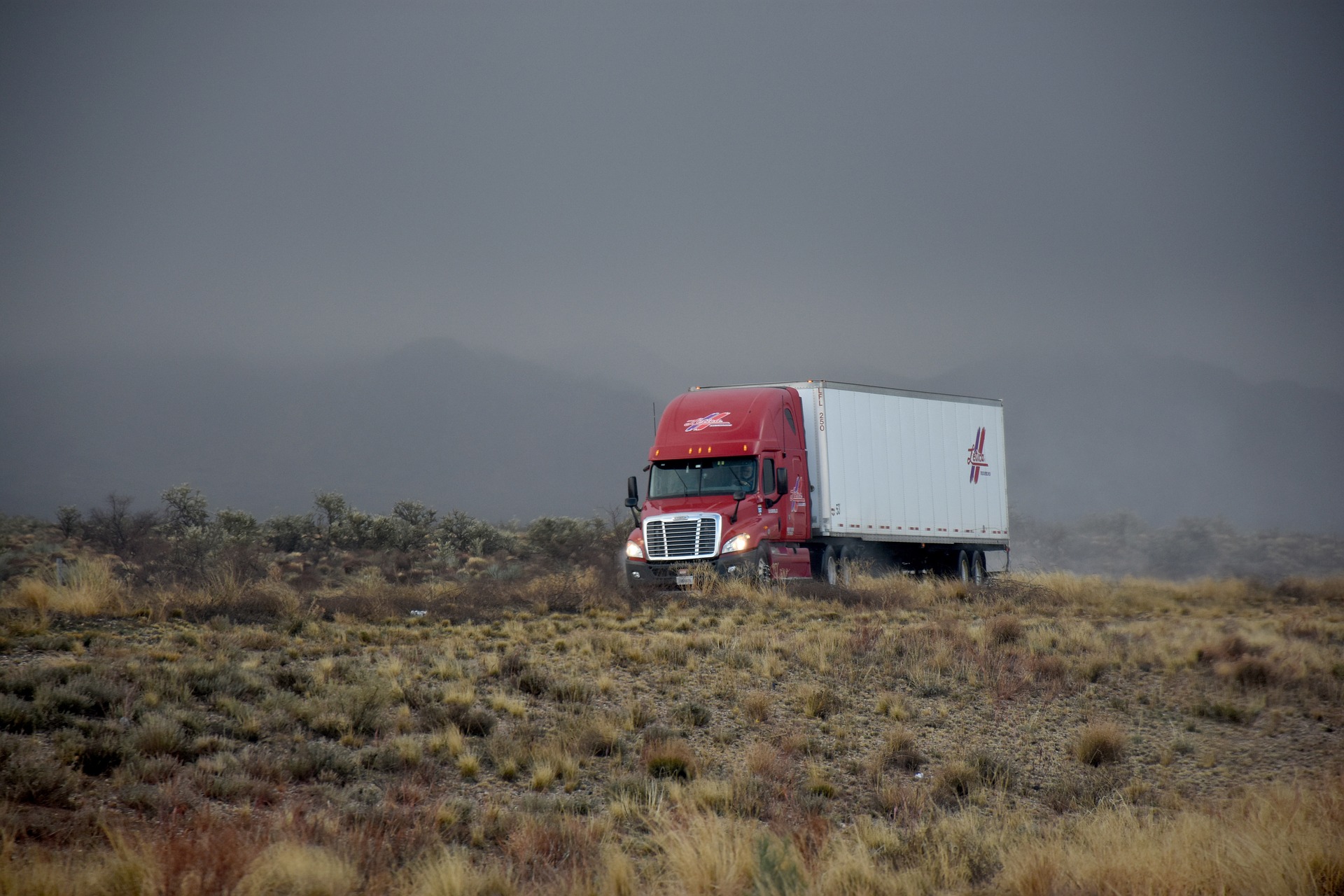 semi truck on the road in the desert