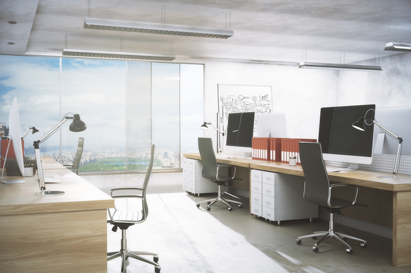 a desk with a laptop in a room