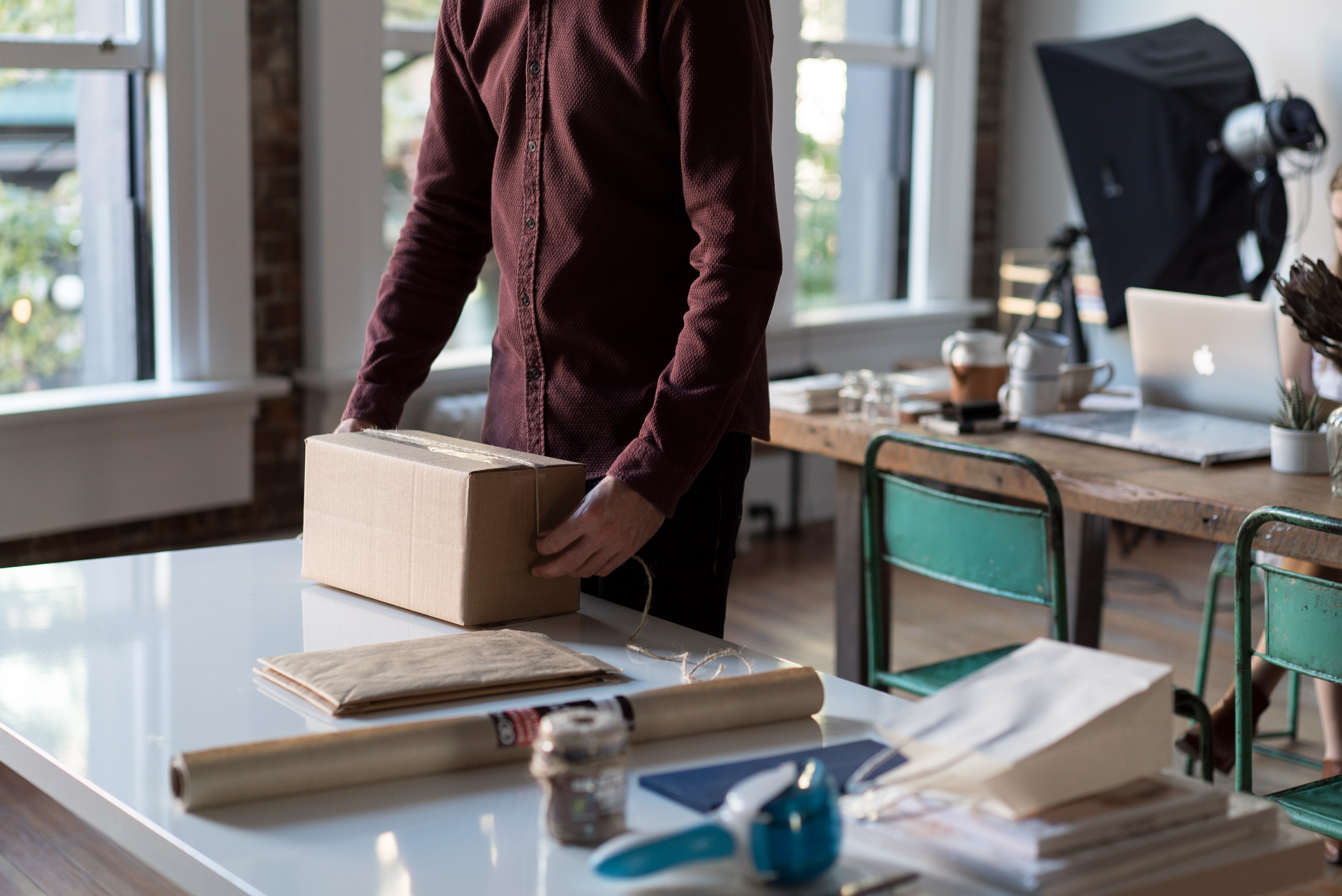 person preparing package for delivery